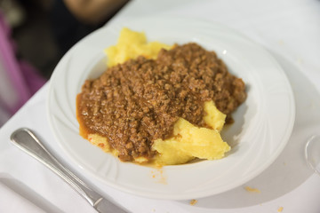 Tasty dish of polenta with meat sauce