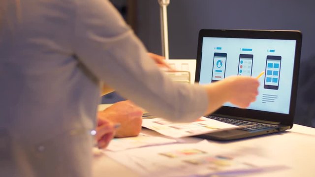 business team with laptop working at night office