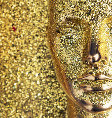 Glittering, golden head of a mannequin