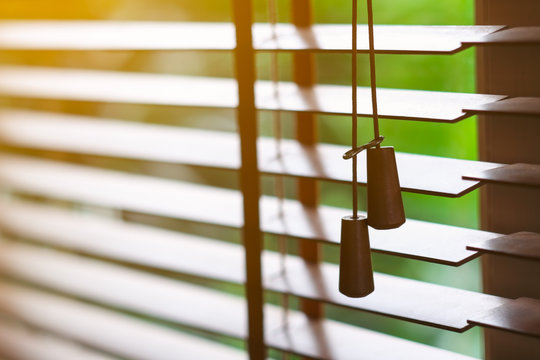 Wooden blinds with sun light.
