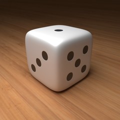 Close up of a single die on wood