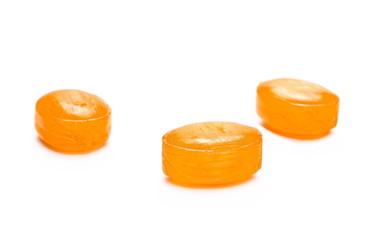 orange candies isolated on white background