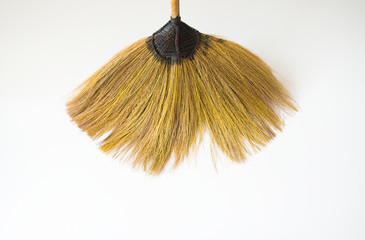 Broom for cleaning on a white background.