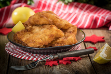 Fried cod slices in breadcrumbs.