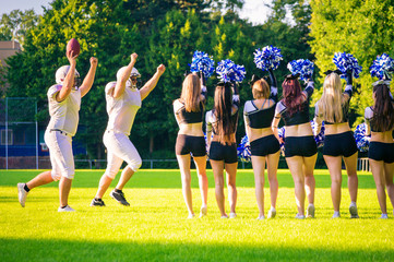 Obraz premium American Football Players With Cheerleaders