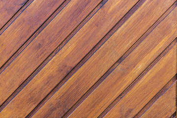 Diagonal strips on a brown wooden background