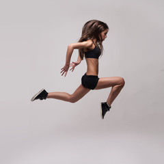 caucasian fitness woman jumping
