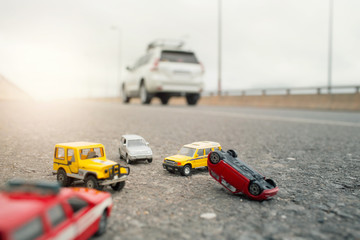 Scene of cars (miniature, toy model ) accident on street.Insurance concept.