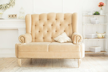 white sofa, armchair stands in a beautiful interior