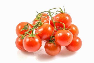 Ripe fresh tomatoes branch isolated on white background with a clipping path.