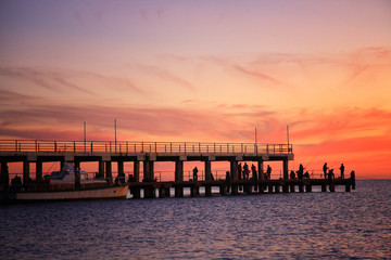 Fototapeta premium Fishing on a sunset