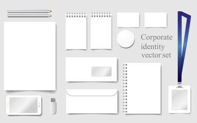 White mock-up vector template for corporate identity with sheet, notepad, envelope, paper, business card, badge, smartphone, pen, pencil, flash drive 