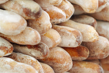 Close-up of baguettes stacked with sunlight