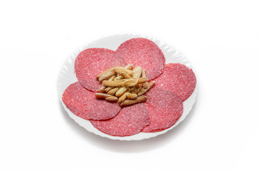 Traditional Salami Sausage dish with breadsticks isolated on white background. Spanish Salami sausage.