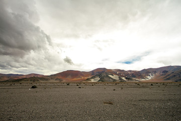 Colorful mountains with stormy background in the Andes in Catamarca, Argentina