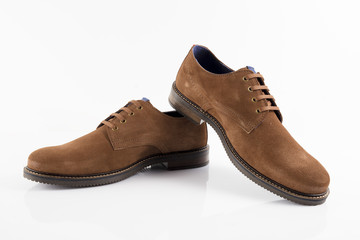 Male brown leather shoe on white background, isolated product, comfortable footwear.