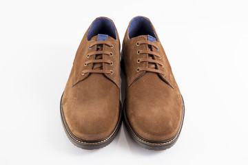 Male brown leather shoe on white background, isolated product, comfortable footwear.