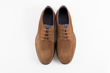 Male brown leather shoe on white background, isolated product, comfortable footwear.