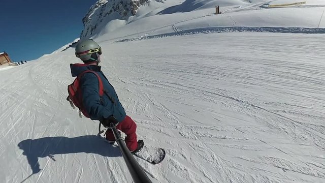 Snowboard freeriding at speed in the French Alps, Champagny-evn-Vanoise, La Plagne, Paradiski, France