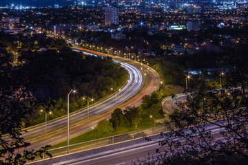 Fototapeta na wymiar Light trails from cars at night in Hamilton, Ontario 