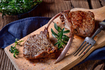 Grilled lamb chops an old board