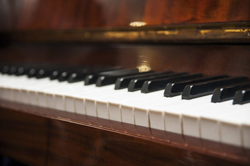 Fototapeta na wymiar Old piano keys. Horizontal. View from the side