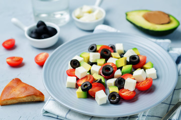 Avocado tomato black olives feta cheese salad