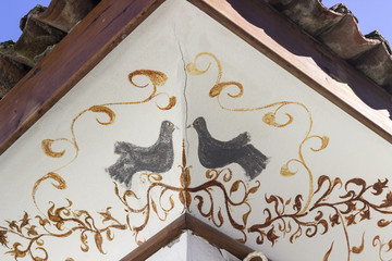 Birds painting as an architectural roof ornament detail