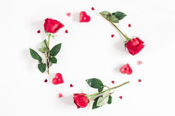 Flowers composition. Frame made of rose flowers, confetti on white background. Valentine's Day background. Flat lay, top view, copy space
