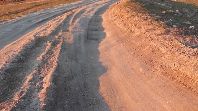 Tumblesweed on the rural road on the sunset