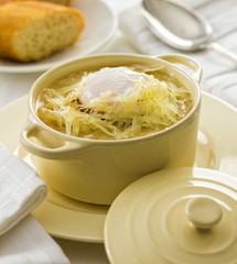 Onion soup with grated cheese and egg.