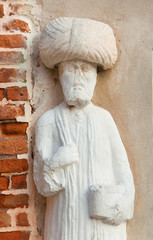 Moorish merchant with turban ancient medieval statue located in Campo dei Mori (Moors Square) in the historic center of Venice (13th century, author unknown)