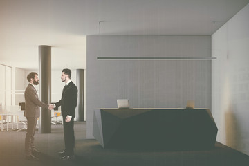 Fototapeta premium Black reception in open space office, people