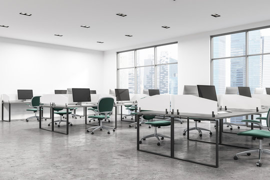Open space office with green chairs