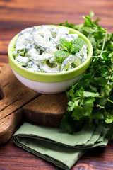 Indian cucumber raita with yoghurt, mint, cilantro. Greek tzatziki sauce
