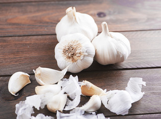 Garlics on brown wooden table. Food