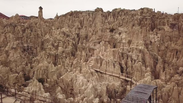 Aerial view of the moon valley tourist place with bridges and stairs to walk through the rock formations. La Paz, Bolivia. 4k