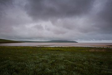 Dawn on the pink Lake Opuk with blossoming shores in the spring