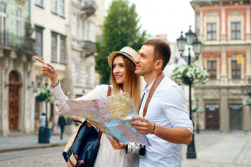 Couple With Map On Travel Vacations, Sightseeing