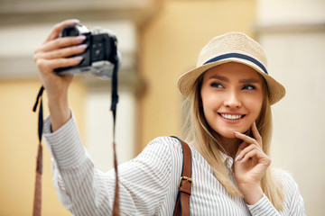 Beautiful Happy Girl Taking Photos On Camera.