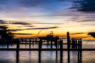 Fototapeta na wymiar Boat Dock and Pier at a Warm Sunset
