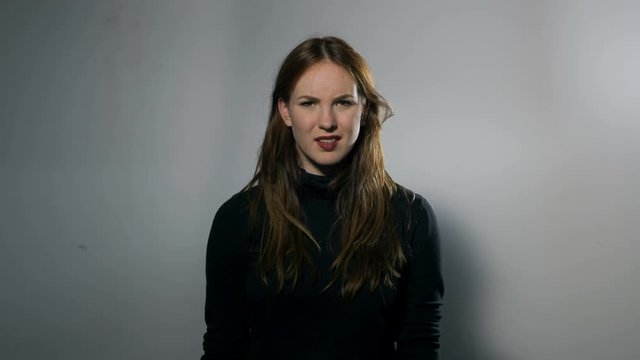 Portrait of a Female Model: Loser Hand Sign