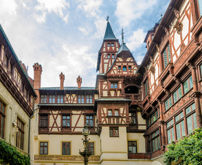 View of the interior courtyard at the Peles Castle in Romania with beautiful details