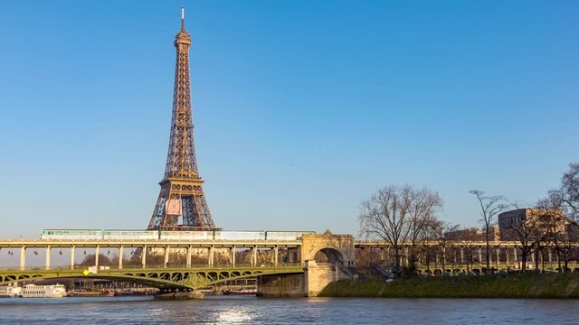 Timelapse of Metro crossing Passy bridge with Eiffel Tower in background - Paris, France