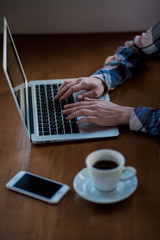 girl working with laptop in cafe