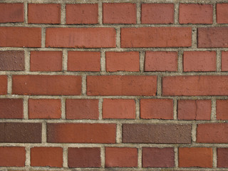 wall made of orange rectangular bricks