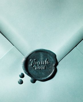 Close up of thank you note in green envelope