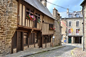 Fototapeta na wymiar Street of half timbered buildings with flowers in the the historic town of Dinan, Bretagne, France
