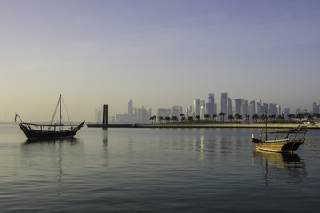 Fototapeta premium Traditional Dhow (original boat from Gulf Area) standing next to the Museum of Islamic Arts. (MIA)