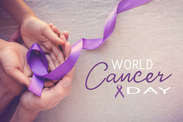 Hands holding Purple ribbons, toning copy space background, Alzheimer disease, Pancreatic cancer,...